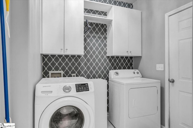 102 Eagle Pass Dr, Taylors, SC 29687 - washroom with washing machine and dryer and cabinet space