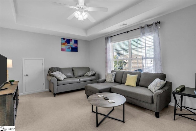102 Eagle Pass Dr, Taylors, SC 29687 - living room featuring a tray ceiling, light carpet, and ceiling fan