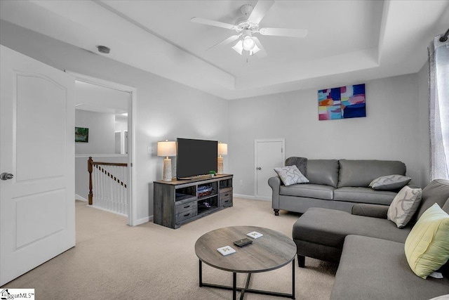 102 Eagle Pass Dr, Taylors, SC 29687 - living room with a raised ceiling, light carpet, ceiling fan, and baseboards