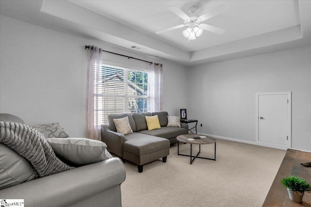 102 Eagle Pass Dr, Taylors, SC 29687 - living room featuring a raised ceiling, a ceiling fan, light carpet, and baseboards