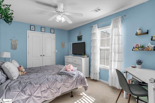 102 Eagle Pass Dr, Taylors, SC 29687 - bedroom featuring light colored carpet, a closet, a ceiling fan, and baseboards