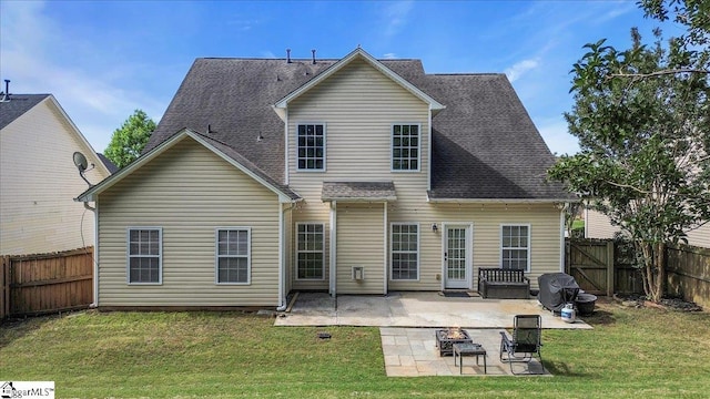102 Eagle Pass Dr, Taylors, SC 29687 - back of property featuring a patio area, an outdoor fire pit, and a shingled roof