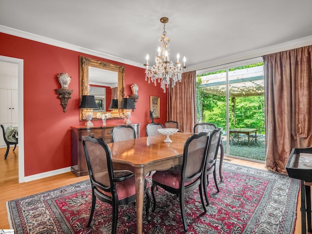 11 Hearthstone Ln, Landrum, SC 29356 - dining space with a chandelier, light wood-style flooring, and crown molding