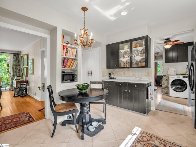 11 Hearthstone Ln, Landrum, SC 29356 - dining area featuring a chandelier, ceiling fan, and independent washer and dryer