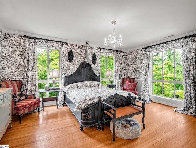 11 Hearthstone Ln, Landrum, SC 29356 - bedroom featuring crown molding, a chandelier, multiple windows, light wood-style floors, and wallpapered walls