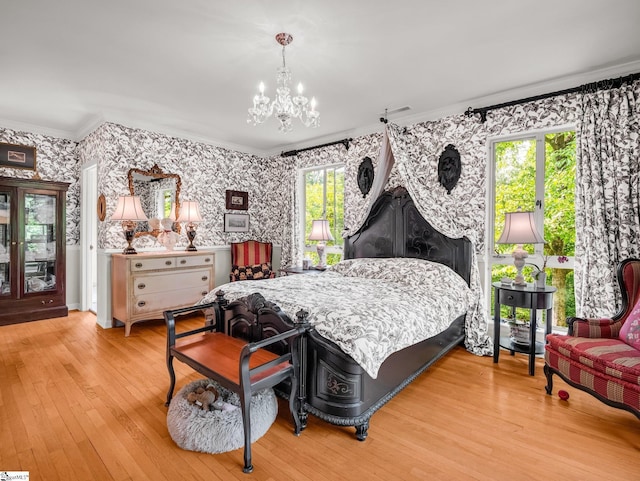 11 Hearthstone Ln, Landrum, SC 29356 - bedroom with ornamental molding, a chandelier, wallpapered walls, and wood finished floors