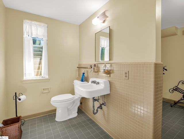 11 Hearthstone Ln, Landrum, SC 29356 - bathroom featuring tile patterned floors, a wainscoted wall, and tile walls