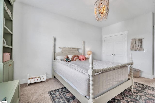 706 Torridon Ln, Simpsonville, SC 29681 - bedroom with carpet flooring, baseboards, a chandelier, and a closet