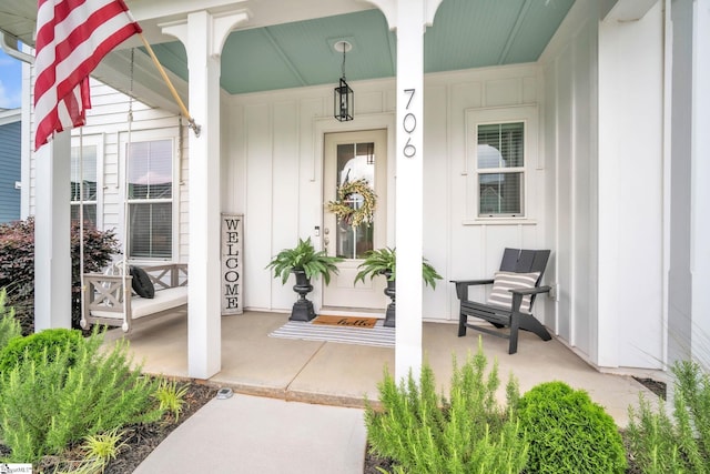 706 Torridon Ln, Simpsonville, SC 29681 - doorway to property with board and batten siding and a porch