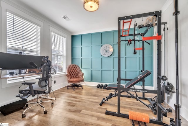 706 Torridon Ln, Simpsonville, SC 29681 - office area featuring wood finished floors, baseboards, and a decorative wall