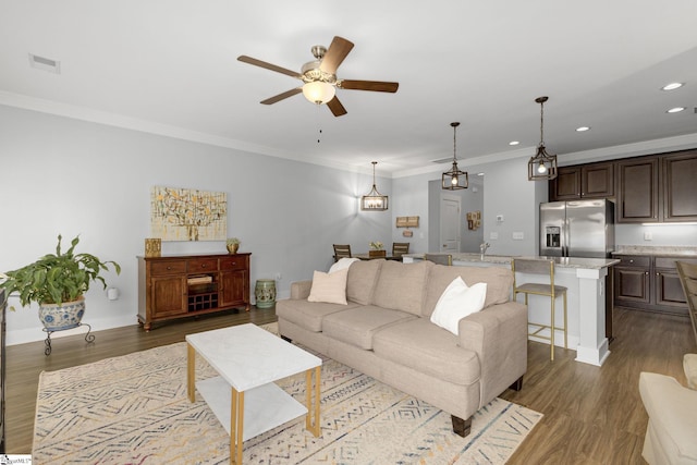 219 Button Willow St, Taylors, SC 29687 - living area with a ceiling fan, dark wood finished floors, crown molding, and recessed lighting