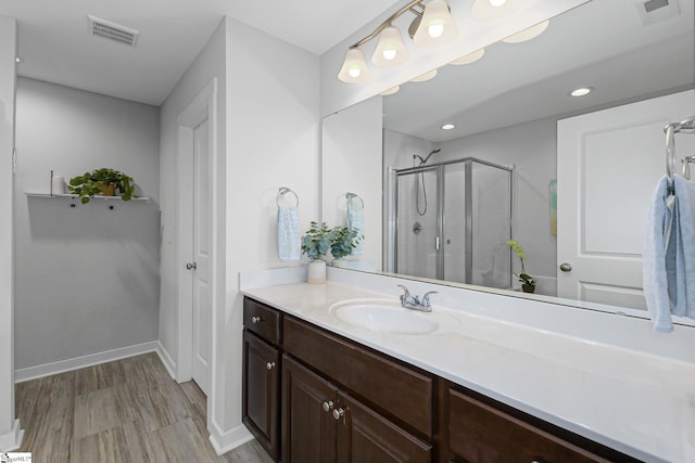219 Button Willow St, Taylors, SC 29687 - bathroom with vanity, a stall shower, wood finished floors, and baseboards