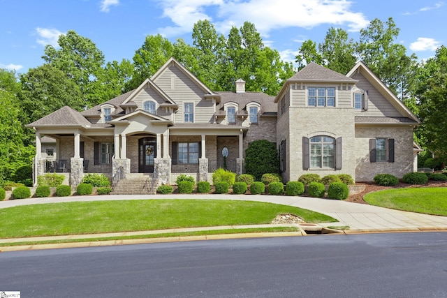 105 Hampton Grove Way, Greenville, SC 29617 - view of front facade featuring a front yard, covered porch, brick siding, and roof with shingles