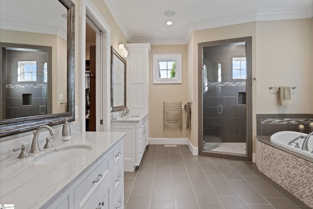 105 Hampton Grove Way, Greenville, SC 29617 - bathroom featuring two vanities, a stall shower, a garden tub, tile patterned floors, and crown molding