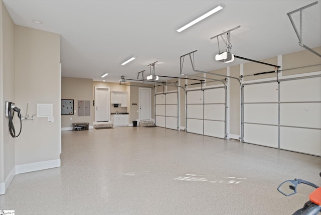 105 Hampton Grove Way, Greenville, SC 29617 - garage featuring baseboards and a garage door opener