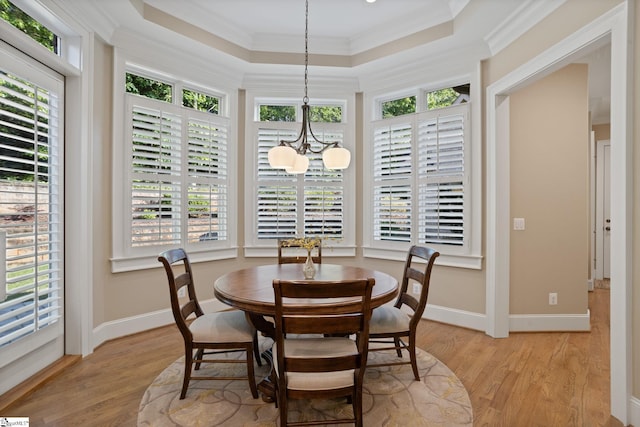 105 Hampton Grove Way, Greenville, SC 29617 - dining space with a chandelier, a tray ceiling, light wood-style flooring, crown molding, and baseboards