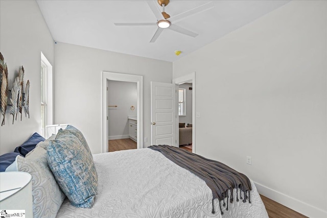 148 Duncan Chapel Rd, Greenville, SC 29617 - bedroom featuring baseboards, wood finished floors, a ceiling fan, and multiple windows