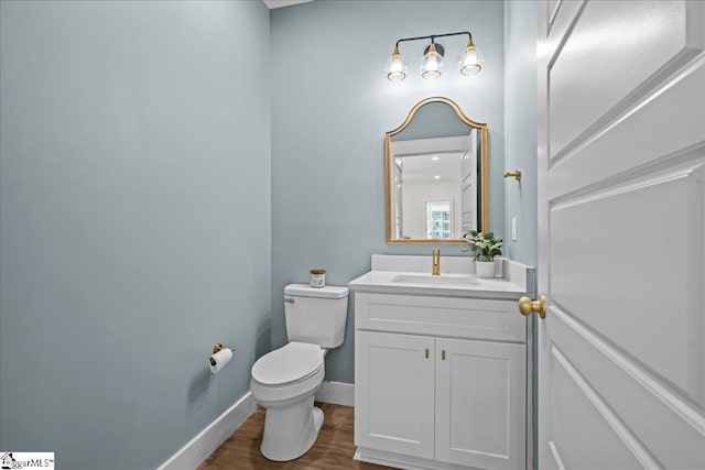 148 Duncan Chapel Rd, Greenville, SC 29617 - bathroom featuring toilet, vanity, wood finished floors, and baseboards