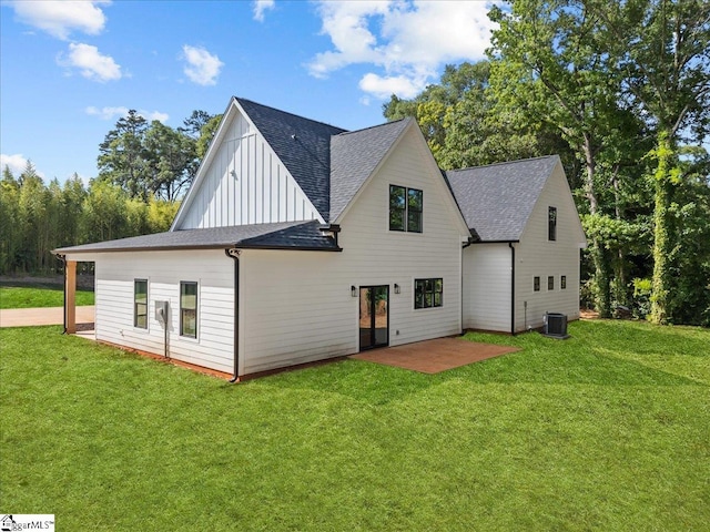 148 Duncan Chapel Rd, Greenville, SC 29617 - back of property featuring a shingled roof, a yard, a patio, and board and batten siding