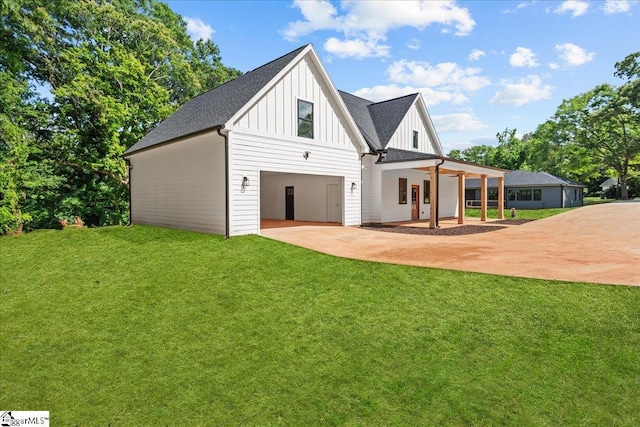 148 Duncan Chapel Rd, Greenville, SC 29617 - view of front facade featuring board and batten siding, driveway, a front lawn, a garage, and roof with shingles