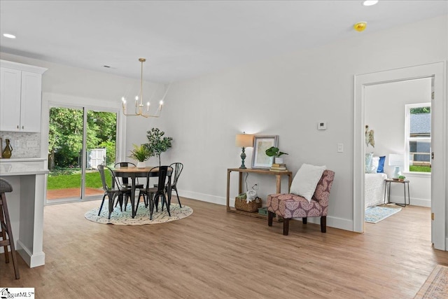 148 Duncan Chapel Rd, Greenville, SC 29617 - dining area with light wood finished floors, a chandelier, recessed lighting, and baseboards