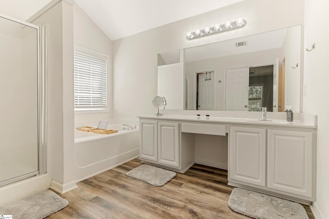 835 Terrace Creek Dr, Duncan, SC 29334 - full bath featuring a stall shower, a bath, vanity, wood finished floors, and lofted ceiling