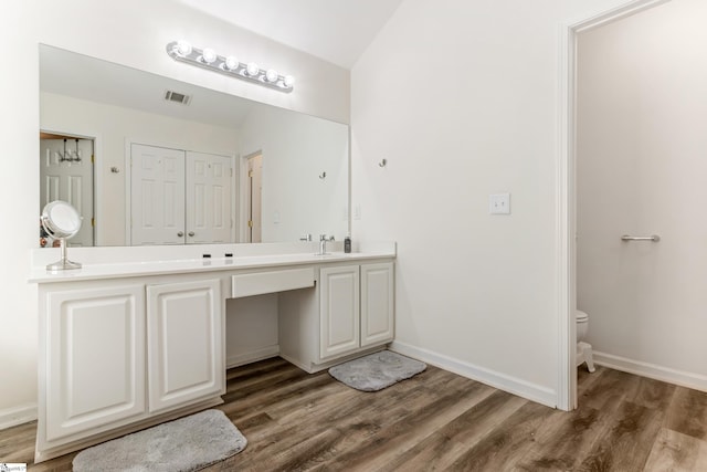 835 Terrace Creek Dr, Duncan, SC 29334 - bathroom with wood finished floors, double vanity, toilet, and baseboards