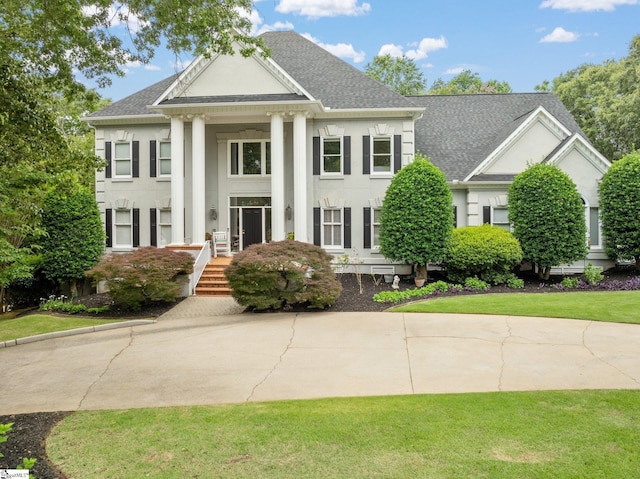 120 Thornblade Blvd, Greer, SC 29650 - neoclassical home with a shingled roof and stucco siding