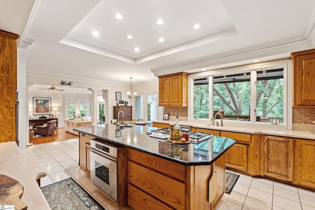 120 Thornblade Blvd, Greer, SC 29650 - kitchen with stainless steel oven, decorative columns, light tile patterned floors, decorative backsplash, and recessed lighting
