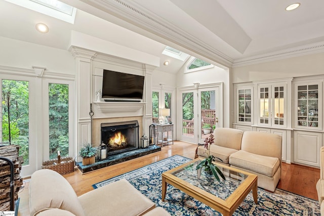 120 Thornblade Blvd, Greer, SC 29650 - living area with a skylight, healthy amount of natural light, a high end fireplace, wood finished floors, and vaulted ceiling