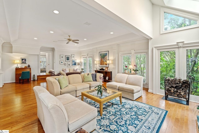 120 Thornblade Blvd, Greer, SC 29650 - living room featuring plenty of natural light, light wood finished floors, a ceiling fan, ornamental molding, and baseboards