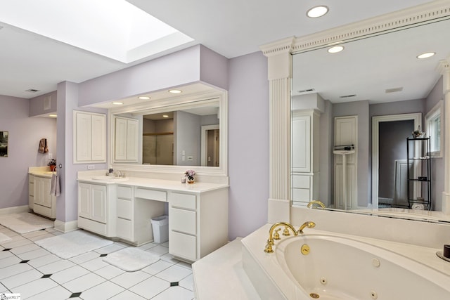 120 Thornblade Blvd, Greer, SC 29650 - bathroom with a tub with jets, a skylight, vanity, recessed lighting, and tile patterned floors
