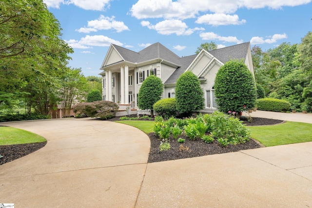 120 Thornblade Blvd, Greer, SC 29650 - greek revival house with stucco siding and a shingled roof