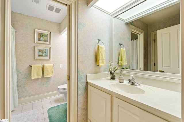 120 Thornblade Blvd, Greer, SC 29650 - full bathroom with tile patterned flooring, toilet, vanity, wallpapered walls, and baseboards