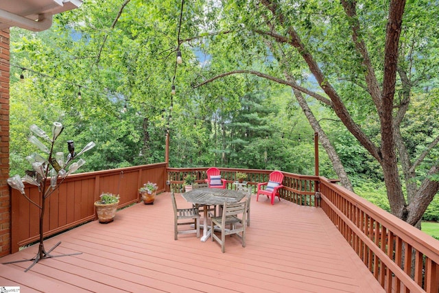 120 Thornblade Blvd, Greer, SC 29650 - wooden terrace with outdoor dining space and a wooded view