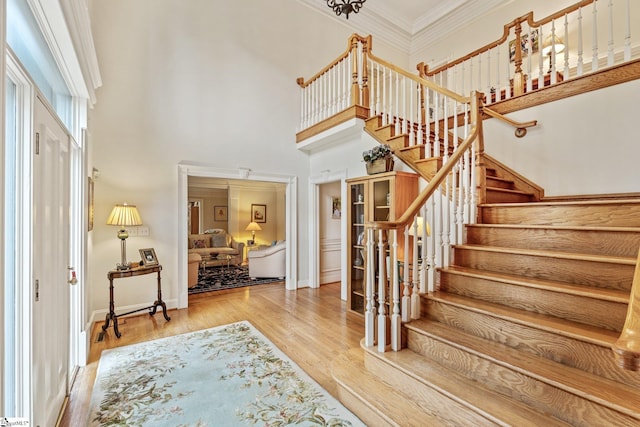 120 Thornblade Blvd, Greer, SC 29650 - entrance foyer with stairs, a high ceiling, wood finished floors, ornamental molding, and baseboards