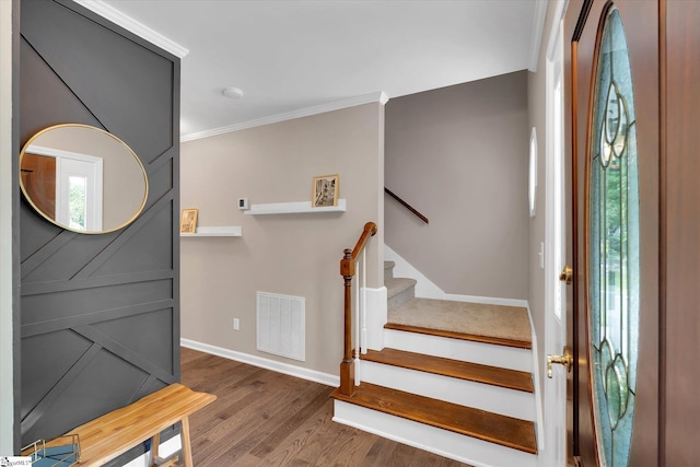 121 Legrae Ln, Taylors, SC 29687 - entrance foyer featuring wood finished floors, crown molding, baseboards, and stairs