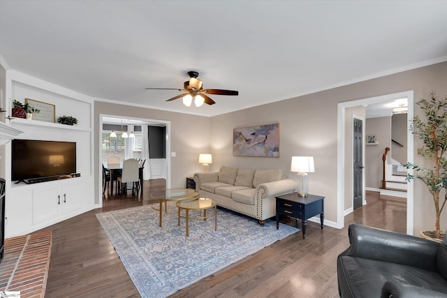 121 Legrae Ln, Taylors, SC 29687 - living room featuring stairs, a ceiling fan, dark wood-style floors, crown molding, and baseboards