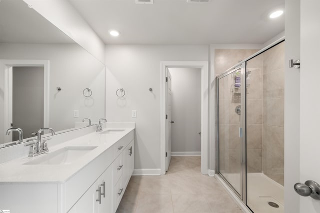 925 Appalachian Dr, Moore, SC 29369 - bathroom featuring double vanity, tile patterned flooring, a stall shower, baseboards, and recessed lighting
