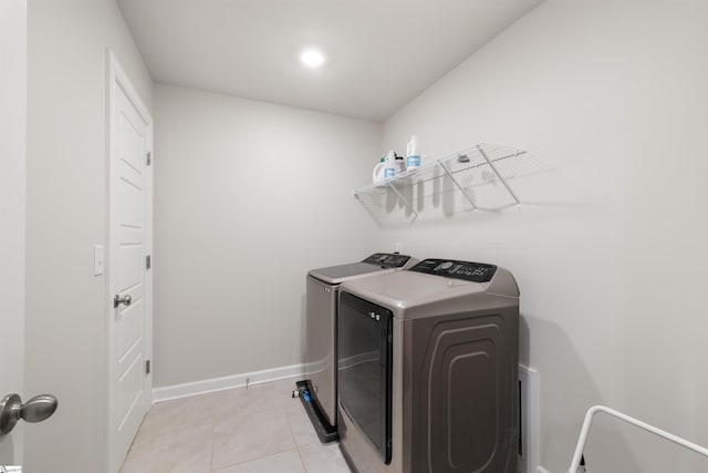 925 Appalachian Dr, Moore, SC 29369 - laundry area with washer and dryer, light tile patterned floors, baseboards, and recessed lighting