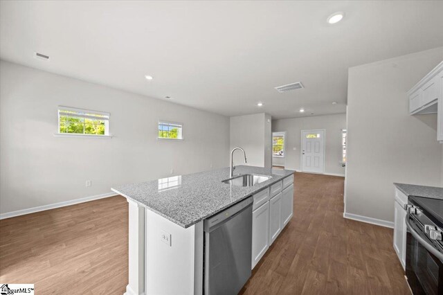 215 Islay Way, Anderson, SC 29621 - kitchen featuring stainless steel appliances, wood finished floors, light stone counters, a center island with sink, and recessed lighting