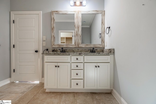 716 Adaline Pl, Inman, SC 29349 - bathroom featuring double vanity, baseboards, and ornamental molding