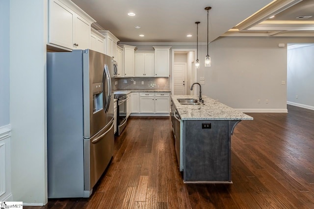 716 Adaline Pl, Inman, SC 29349 - kitchen featuring stainless steel appliances, a sink, dark wood finished floors, light stone counters, and white cabinets