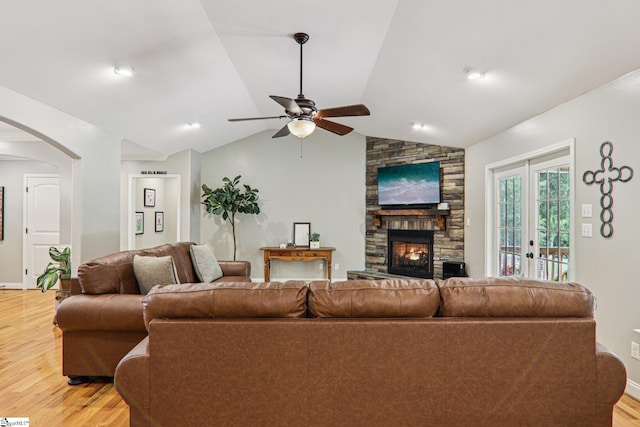 310 Wofford Rd, Pauline, SC 29374 - living area with light wood-style floors, arched walkways, a stone fireplace, a ceiling fan, and baseboards