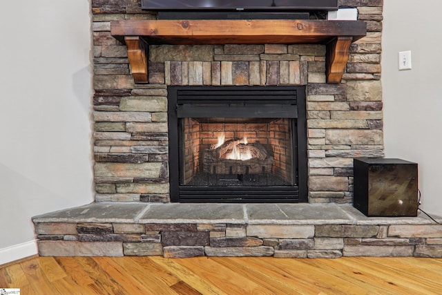 310 Wofford Rd, Pauline, SC 29374 - detailed view of a stone fireplace, baseboards, and wood finished floors