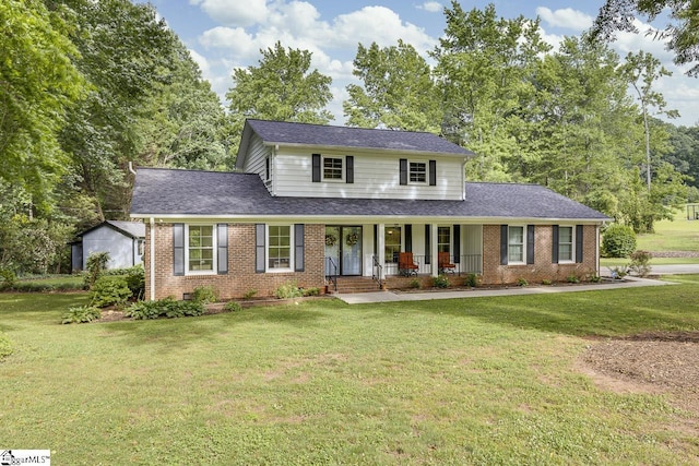 9 Mountain Brook Trl, Greenville, SC 29609 - traditional-style house featuring a porch, brick siding, a front lawn, and roof with shingles