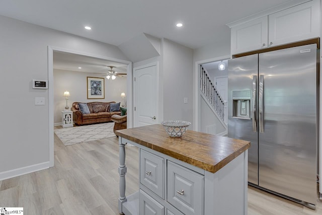 9 Mountain Brook Trl, Greenville, SC 29609 - kitchen featuring stainless steel fridge, wooden counters, light wood finished floors, white cabinetry, and recessed lighting