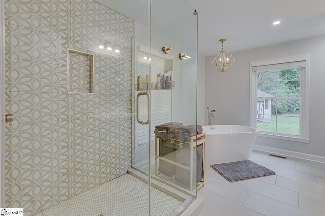 9 Mountain Brook Trl, Greenville, SC 29609 - full bathroom with a stall shower, tile patterned floors, a freestanding bath, a chandelier, and recessed lighting