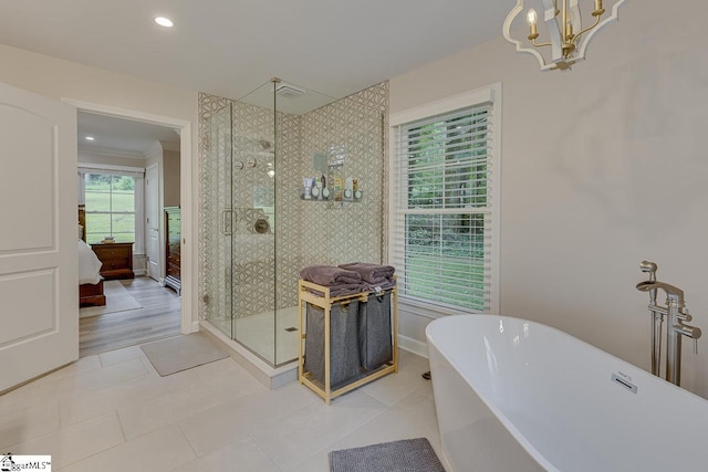 9 Mountain Brook Trl, Greenville, SC 29609 - ensuite bathroom featuring a soaking tub, a shower stall, a chandelier, tile patterned flooring, and recessed lighting