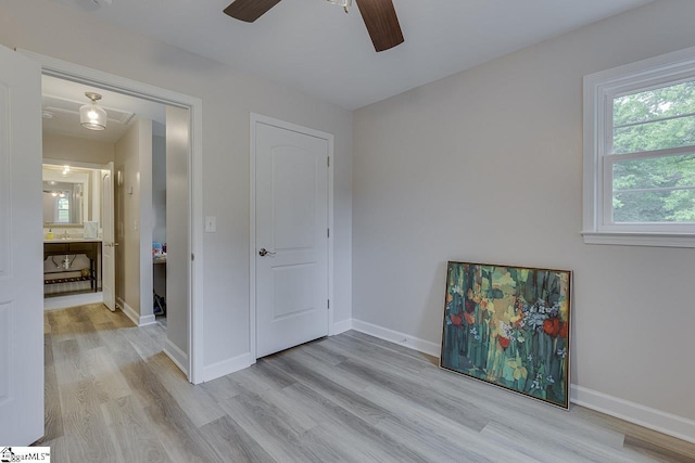 9 Mountain Brook Trl, Greenville, SC 29609 - unfurnished bedroom featuring light wood-type flooring, baseboards, and a ceiling fan